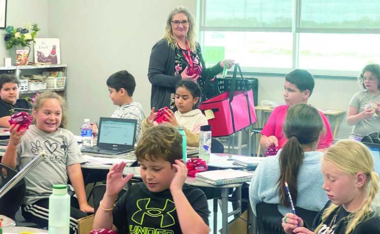 Third-grade students at Pauls Valley Elementary School learned about saving their money last week as part of a “Teach Children to Save Day” presentation by Pauls Valley’s First United Bank employees. Students watched a video about how U.S. coins are minted, identified a variety of coins and the value of each, discussed the difference between needs and wants and learned about developing the habit of saving money for things they want. Each student also received a complimentary piggy bank.