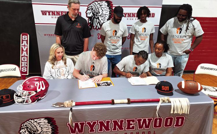 Wynnewood football players Phoenix Delaplain and Marques Williams signed letters of intent to attend Hendrix College in front of family and peers Feb. 4. Pictured, seated, from left, Holly Delaplain, Phoenix Delaplain, Marques Williams, Kesha Williams, standing Dusty Delaplain, Sheldon Williams, Tariq Williams and Keyante Prince. News Star photo by Jennifer Lindsey