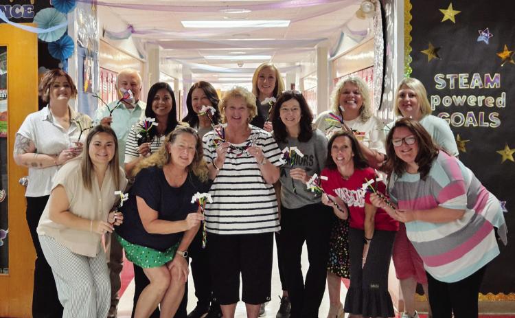 Maysville Elementary School Team shows off their Reading Rope models made during a training from the Oklahoma Literacy Initiative. Pictured, from left, front: Maggie Shannon, Susan Green, Kendra Schenk (OLI Consultant), Kimberly Layton, Mandy Russell, Kelsey Ring; back: Kevan Fortney, Principal John Edwards, Kortney McCaskill, Jennifer Nimmo, Kacee Uhles, Mandee Anderson and Jessica Dean. Courtesy Photo