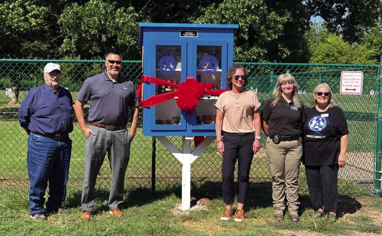Pauls Valley City Manager Joe Livingston, City Councilman Kahn Nirschl, pantry sponsor Cheryl Flowers, Camryn Williams with PV Animal Welfare and Pauls Valley Animal Welfare Society President Marjie Little were on hand Friday to dedicate the new Pets &amp; People Pantry. Photo by Suzanne Mackey