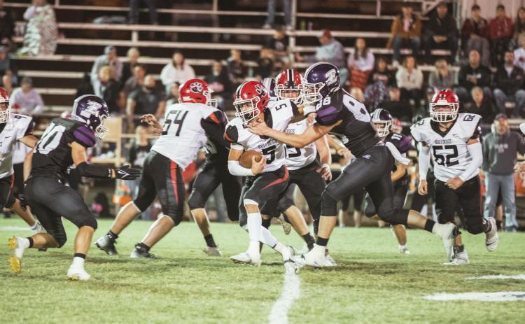 Stratford’s Hunter Morton tries to run through the Elmore City-Pernell defensive line in last week’s game. Stratford’s defense helped the Bulldogs pull out a 34-6 win. Photo by Jake Faucett