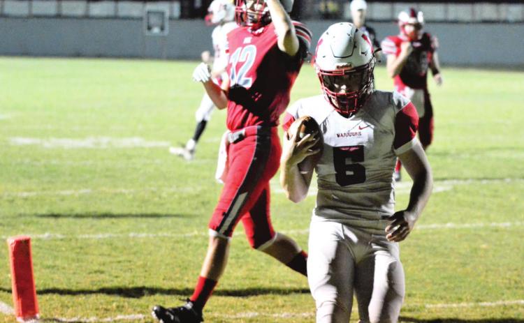 Nigel Reid scores a touchdown against Fox. Photo by Denny Park