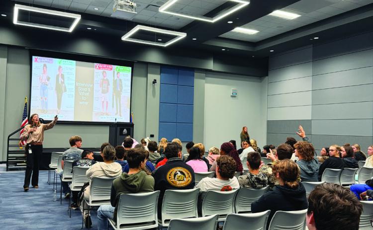 Toni Gay of Coffeyville Resources’ Wynnewood Refining Company talks with Mid-America Technology Center first-year students about what to wear to a job interview during the “Resume to Rockstar” session at Advantage Day Oct. 15. Photo courtesy of Mid-America Technology Center