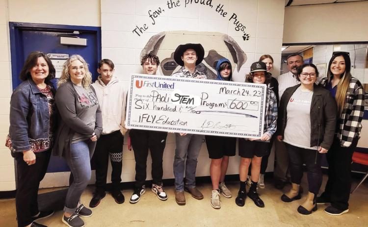 Pictured left to right are Della Wilson and Danielle Caldwell with First United Bank; Paoli Alternative Education students Kalib Hobbs, Kaleb Brown, Isaac Burt, Braddyn Swafford, Baylon Wigley and Eveyon Martin; Paoli Superintendent David Morris; Grace Farnan with First United Bank; and Lauren Cook, director of Paoli’s Alternative Education Program.