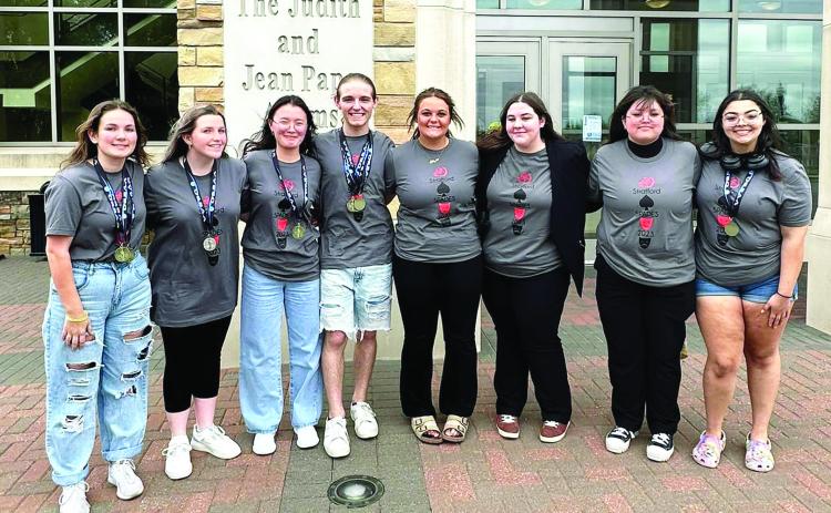 Team members include (left to right): Sayla Hall, Aryah Tackett, Nazik Saitbekova, Carter Clark, Haylee Dickerson, Abbie Wigley, Natalie Kirkley and Rachael Vandiver.