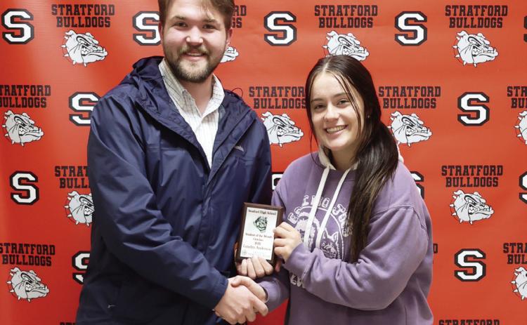 Caleb Stout of Oklahoma Heritage Bank presents Lundyn Anderson with her student of the month award. Anderson, a senior at Stratford High School, is the daughter of Tammy and Willy Anderson.