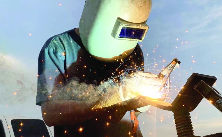 “Arc Welder Welding” by Cooper McKinzie of Wynnewood won Best of Show and first place in the People category in this year’s 4-H photography contest.