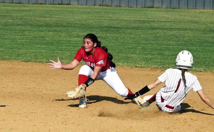 Wynnewood‘s Olivia White slides into base during Monday’s 6-2 home loss to Sulphur. News Star photo by Don Coffey