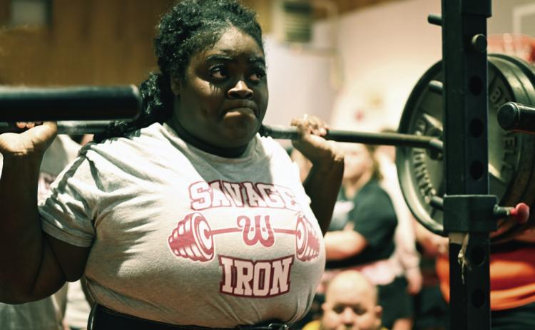 Annika Pittman of Wynnewood performs a squat at the South Regional Meet in Tishomingo. News Star photo by Don Coffey