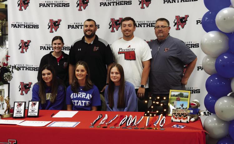 Pauls Valley senior Erin Gray (seated center) signed a letter of intent Wednesday to play golf at Murray State College this fall. News Star photo by Chris Mackey