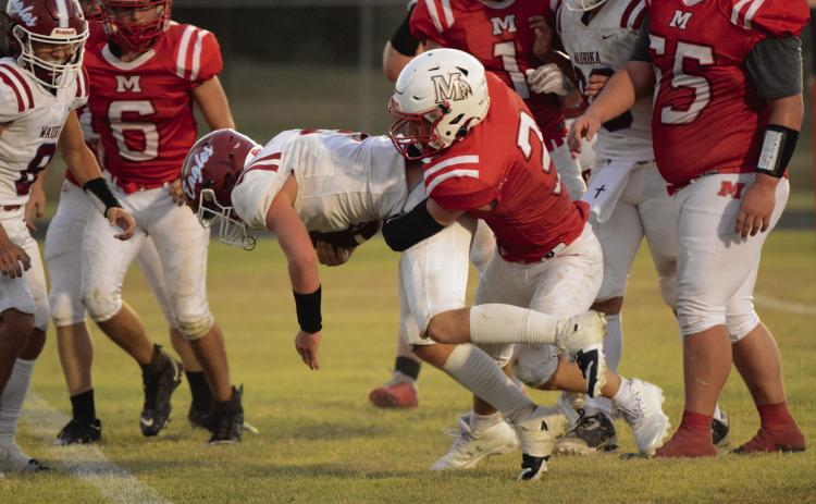 Maysville’s Josh Wilson tackles a Waurika Eagle during last week’s 58-8 loss. The Warriors have a bye this week to prepare for the start of district play next week. News Star photo by Denny Park