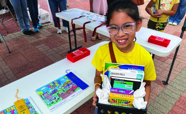Sofia Barahona won first place in the third grade division of the Chamber of Commerce’s coloring contest during Saturday’s Brickfest celebration. The coloring contest was open to children in kindergarten thru third grade. Photo by Suzanne Mackey
