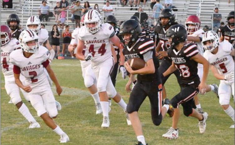Wynnewood’s #2 Jett Anderson and # 44 Cache Mooney stalk the Wayne runningback down the line. News Star photo by Don Coffey
