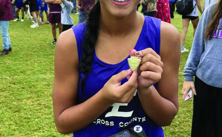 Elmore City-Pernell’s Remlee McIntosh shows off her medal at the 2025 Regional Meet. Courtesy photo