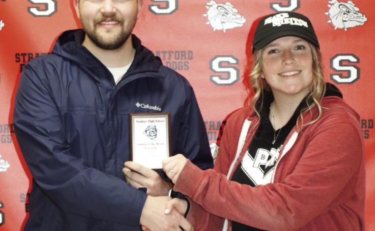 Caleb Stout with Oklahoma Heritage Bank presents Stratford freshman Araya Tackett with her Student of the Month award for November.