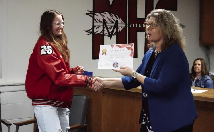Maysville archery students received certificates of recognition from Superintendent Shelly Hildebrandteam recently placed first at the OKNASP 2023 East Region Tier 2 State Championship in Tulsa. Alea Sherrill (left) scored the third highest individual score at the event. Beach during the Maysville Board of Education's regular meeting Monday. Maysville's archery
