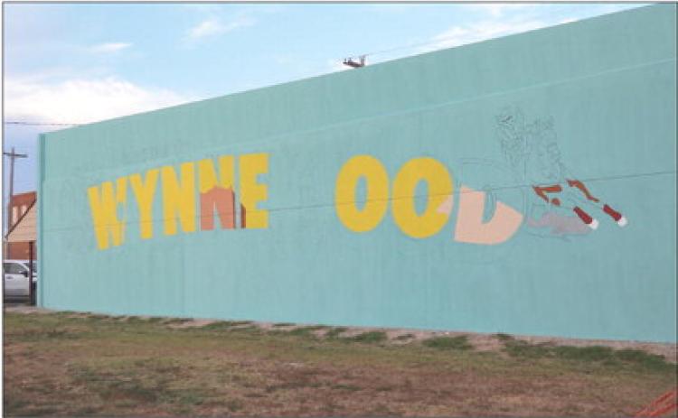 Work is underway on a new mural welcoming visitors to Wynnewood. The mural is located at S. Washita Ave. and Robert S. Kerr Blvd. and is visible to drivers traveling eastbound on U.S. Highway 77.