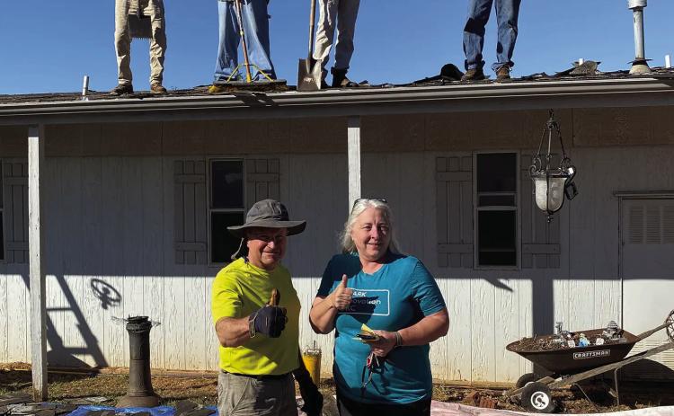 Ed Bevers, front left, leads a team of volunteers during a roofing project for Recovering Oklahomans After Disasters. Bevers was recently named chairman of the ROAD board of directors. Courtesy photo