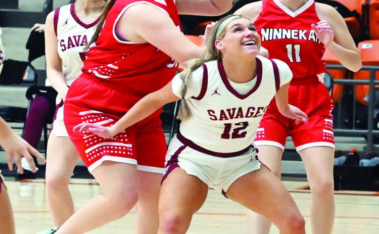 Wynnewood’s Lady Savages competed at the Longhorn Classic in Alex last weekend. Lady Savage Addie Rozzell blocks two Ninnekah players for a rebound. News Star photo by Don Coffey