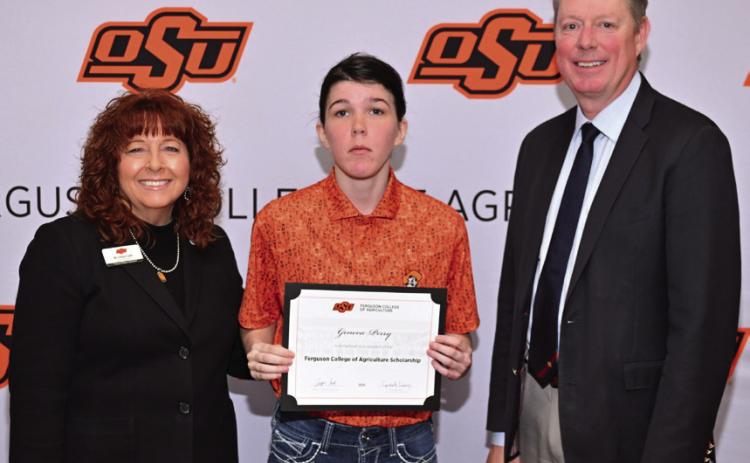 Cynda Clary, associate dean for academic programs, and Jayson Lusk, dean for the Ferguson College of Agriculture, present Geneva Perry with a scholarship