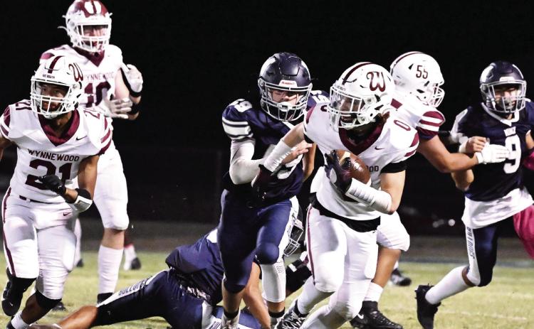 Wynnewood’s #0 Aydrian Knighten, #21 Brylan Williams and #55 Adrian Hernandez plow through the Bulldog defense during the Savages’ 10-0 win over Minco last Friday. The Savages play Okemah at home this week. Okemah is 1-4 on the season and lost 24-0 to Frederick last week. Kickoff is scheduled for 7 p.m. News Star photo by Don Coffey