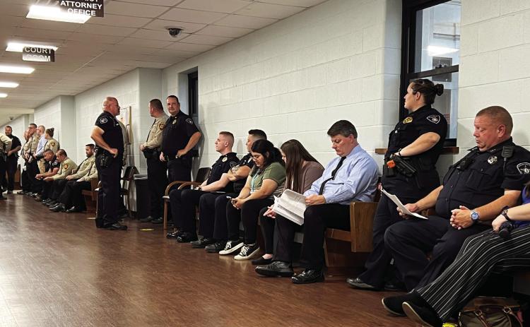 Law enforcement officers from multiple local departments lined the halls outside a courtroom at the Garvin County Courthouse Tuesday morning waiting for a preliminary hearing to begin for William Philpott. The turnout was in support of officers who were shot at during an incident near the Pauls Valley City Lake in June of 2022. News Star photo by Suzanne Mackey