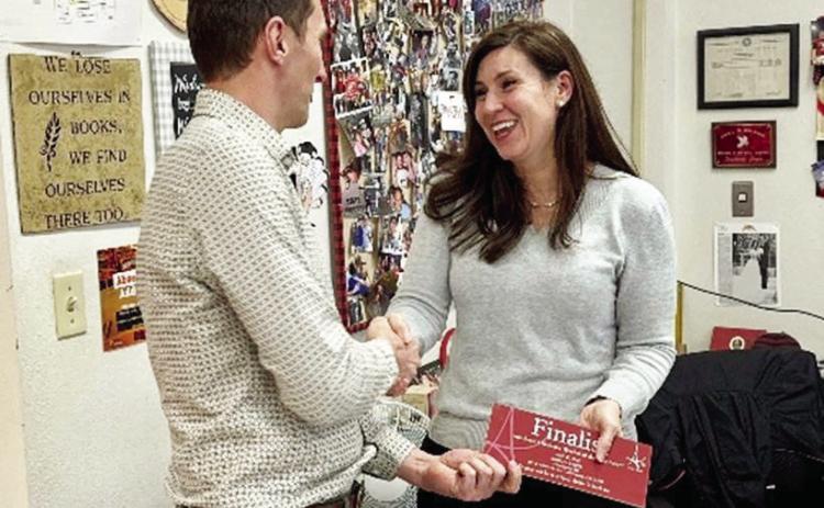First United Community Bank President J.D. Bostic presents Courtney Green with notification she is a finalist for the 2023 Southeast Oklahoma Teacher of the Year award presented by the Aeros Awards of Excellence. Green teaches eighth grade English at Pauls Valley Junior High School.