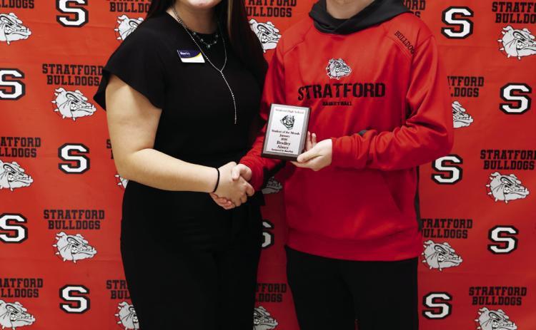 Stratford High School junior Bradley Abney receives his January Student of the Month award from Hannah Vanschuyver, BancFirst.
