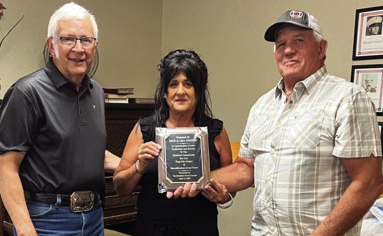Stratford Mayor Johnny Mann (right) presented Rick and Lisa Griffin (left) with a plaque of appreciation from Stratford’s Town Board Tuesday evening for their dedication and service to the community.