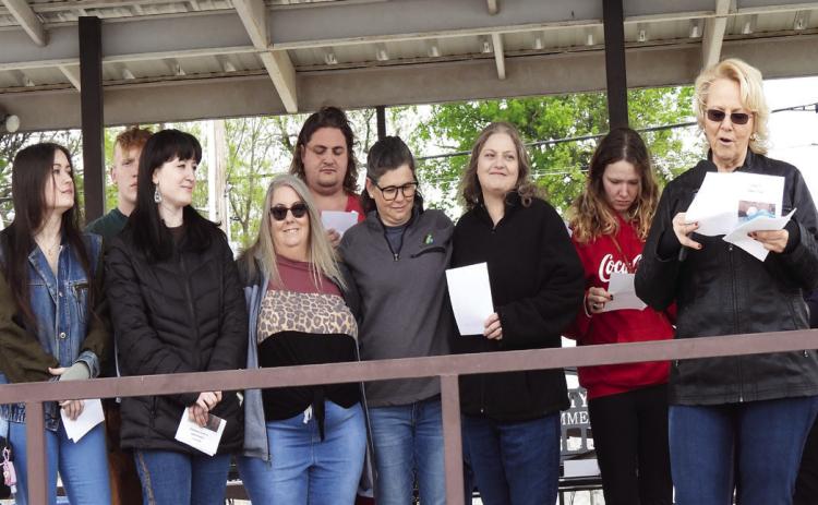 Family members of Tammy Briggs gathered on the Main Street Stage during Saturday’s Footloose Festival as a new award in memory of Briggs was unveiled.