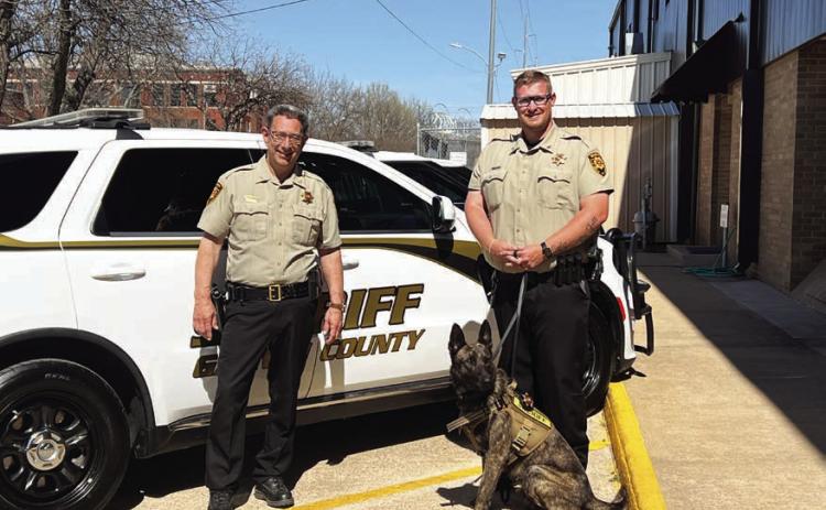 Garvin County Sheriff Jim Mullett (left) and Deputy Dakota Garrison (right) recently welcomed a new K-9 officer to the Sheriff’s Office. Deputy Jackson, a 2-year-old Dutch shepherd, will serve the county as a drug detection dog. News Star photo by Suzanne Mackey