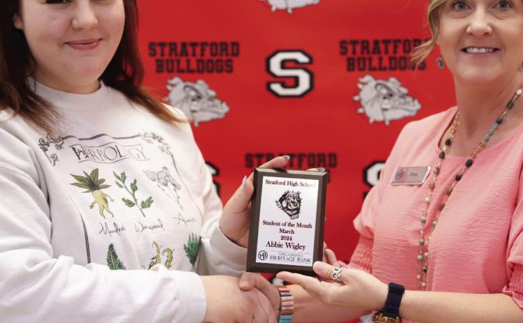 Stratford senior Abbie Wigley receives the March student of the month award from Dina Henley of Oklahoma Heritage Bank.