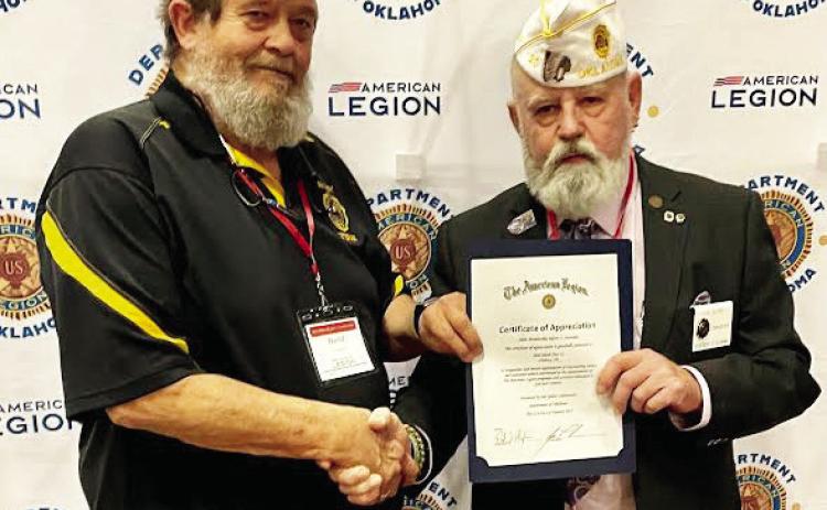 David Hardin (left), commander for the American Legion Ball-Smith Post 23 in Lindsay, receives a certificate of appreciation from a Legion official at the group’s Mid-Winter Conference. The Lindsay post exceeded their membership goal with 112% participation. News Star photo courtesy of Sheryl Kochert.