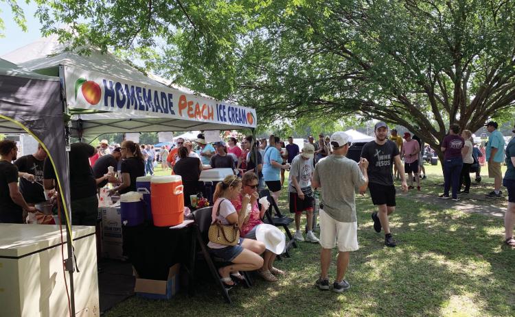 Crowds stand in line for a taste of the Burnett family’s homemade peach ice cream at the 2021 Stratford Peach Festival. Always a big draw, the ice cream stand is a staple at the annual Peach Festival and will be returning again for this year’s event July 15. News Star photo by Chris Mackey