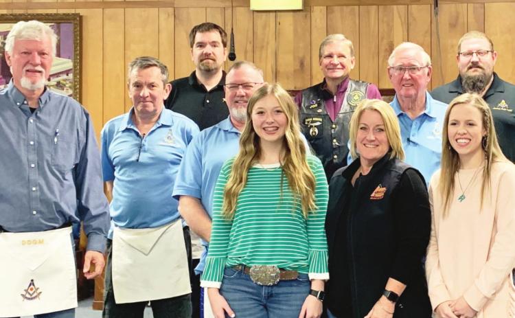 Garvin County 4-H member Karlie Koesler of Pauls Valley, 4-H Director Melissa Koesler, and Ryan Burch of Elmore City 4-H accepted fundraising award checks from Garvin County Masonic Lodges this week.