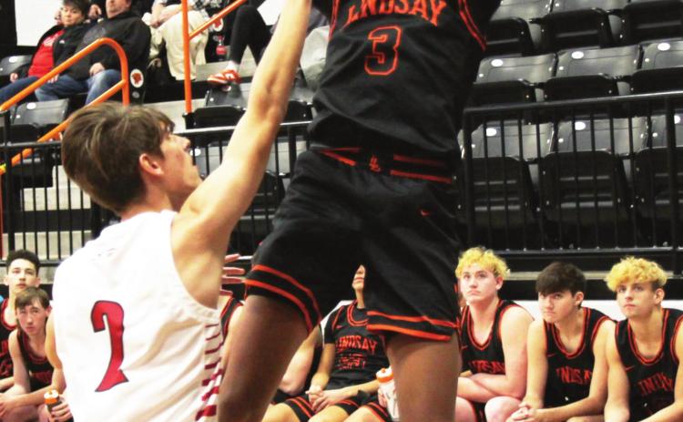 Ryein Kennedy dominates with his mid-range jumper as he puts two more points on the scoreboard for the Leopards against Plainview. Photo courtesy of Sheryl Kochert