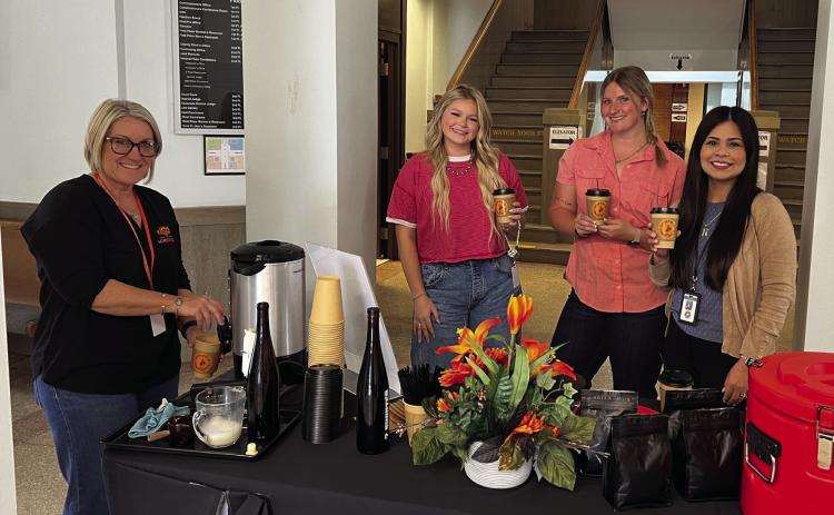 The Garvin County Extension Office offered free coffee from Stratford's 7 Shooter Coffee Co. to courthouse staff and visitors during its Coffee and Conversations event Monday morning in celebration of 112 years of OSU Extension. Pictured left to right are Garvin County Extension Director Melissa Koesler, Garvin County Treasurer's Office staff Kobee Jones and Celene Burke, and Garvin County Treasurer Cyndi Nunez. News Star photo by Suzanne Mackey