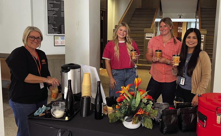 The Garvin County Extension Office offered free coffee from Stratford's 7 Shooter Coffee Co. to courthouse staff and visitors during its Coffee and Conversations event Monday morning in celebration of 112 years of OSU Extension. Pictured left to right are Garvin County Extension Director Melissa Koesler, Garvin County Treasurer's Office staff Kobee Jones and Celene Burke, and Garvin County Treasurer Cyndi Nunez. News Star photo by Suzanne Mackey
