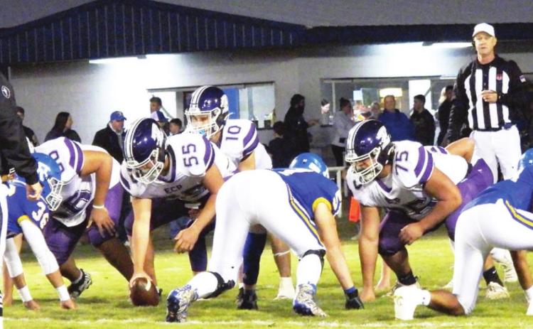 The Badgers and Blue Demons wait for the snap during the A-4 District Championship game last Friday night.