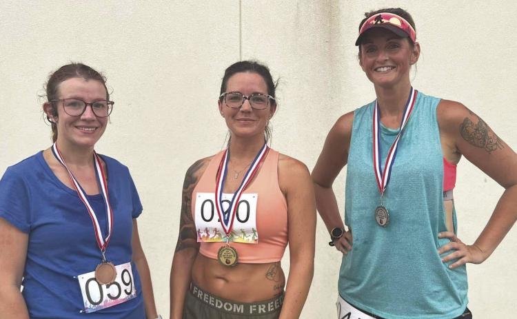 The top three runners in the women’s division were (l-r) Chelsie Kubiak, third place; Lexi Christensen, first place; and Shay Mullins, second place.