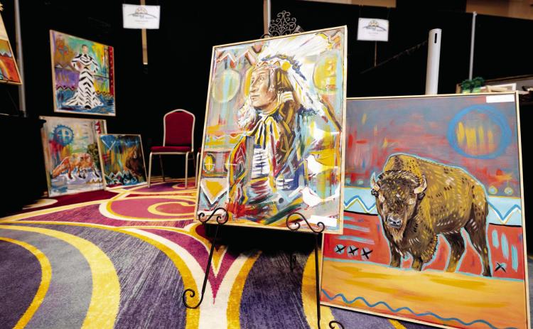 The Chickasaw Nation invites First American artists to share creative works at Hustola Art Market. Paintings pictured by Chickasaw artist Tyson Hudson during the 2023 Hustola Art Market. Applications for 2024 are available at HushtolaArtMarket.com.