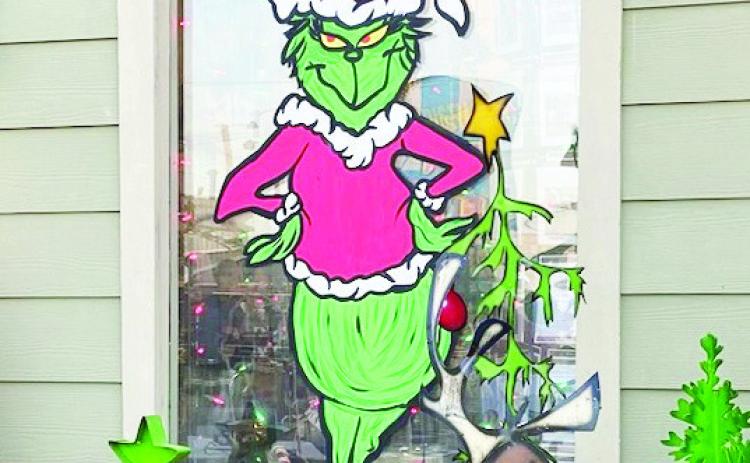 Artist Angela Beene won first place in the window painting category of the Pauls Valley Chamber of Commerce's window decorating contest for her artwork at Bloomin' Crazy.