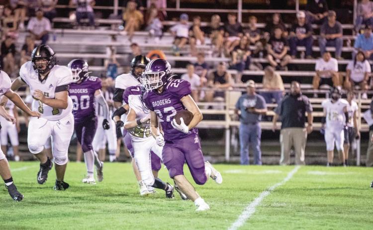 Elmore City-Pernell’s Cason Johnson tries to run around the defensive edge of the Allen Mustangs in Friday's 47-30 loss. The Badgers fought a tough game and look to rebound as they travel to District 2A-4 Tishomingo on September 16. Photo by Jake Faucett