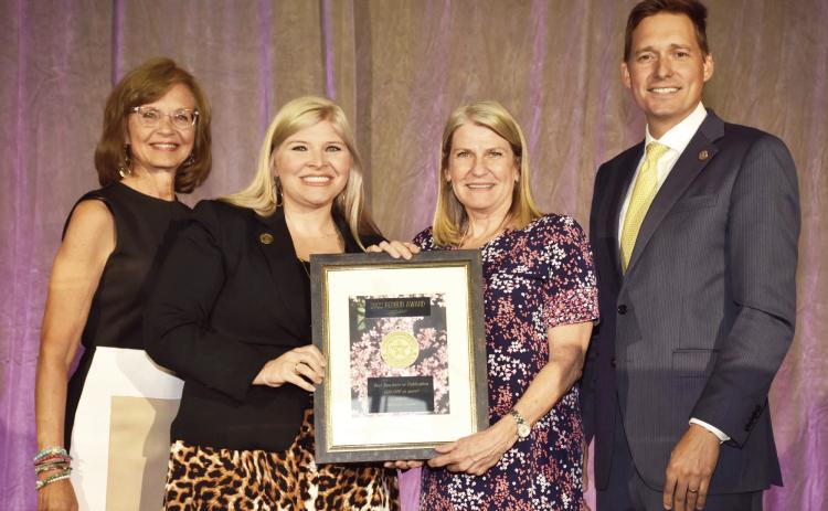 Chickasaw Country was recently honored for efforts to boost tourism in Oklahoma. The RedBud Awards represent the highest honor in the Oklahoma tourism industry. Pictured from left to right, Jenifer Reynolds, Discover Oklahoma; Paige Williams Shepherd, Ed.D., Chickasaw Nation Director of Corporate Development and Tourism; Angel Green, Chickasaw Country Senior Manager Tourism Sales and Marketing; and Oklahoma Lt. Governor Matt Pinnell.