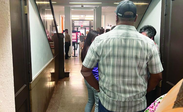 Voters lined up at the Garvin County Courthouse Wednesday for early voting