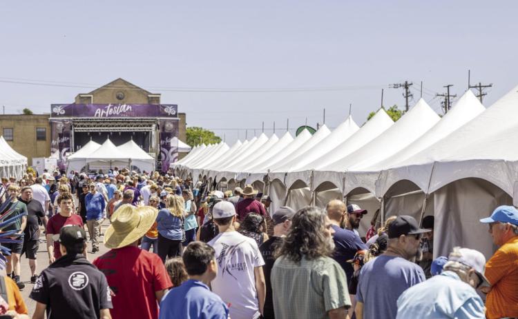 Art patrons at the 2024 Artesian Arts Festival. The 2025 Artesian Arts Festival will take place April 5 at the Artesian Plaza, adjacent to the Artesian Hotel and Spa, 1001 W. First St., Sulphur.