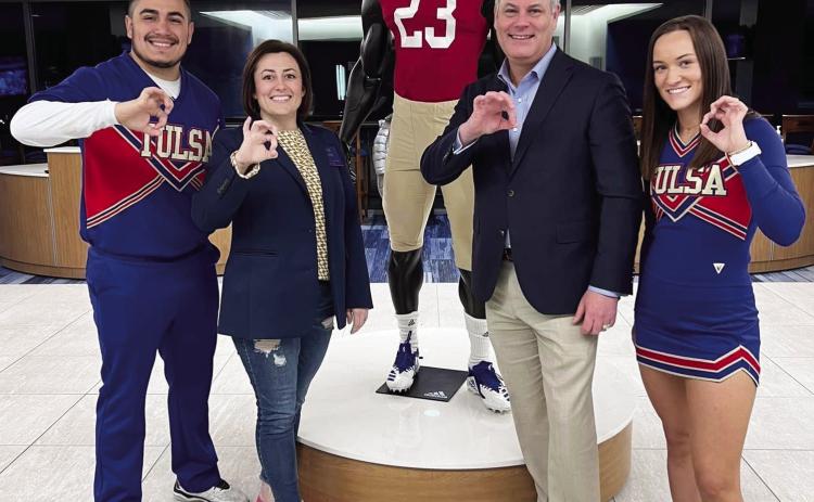 Sen. Jessica Garvin and Sen. James Leewright, R-Bristow, pose with members of the University of Tulsa’s cheer squad during a recent tour of the campus with Leadership Oklahoma.