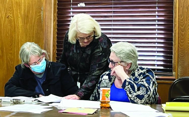 Garvin County Election Board Chair Pam Spaeth, Secretary Gayla Dean and Vice Chair Mary Bogan deliberating during hearings to decide contests of candidacy Feb. 16. News Star photo by Suzanne Mackey