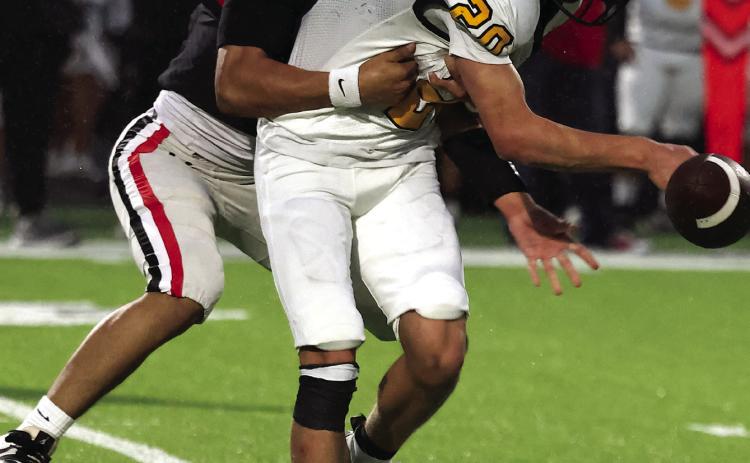 Josh Capuchino forces a Madill fumble during Pauls Valley’s 35-0 win over the Wildcats Friday night. Photo by Mike Arie