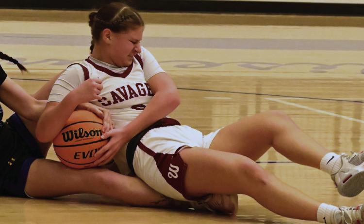 Wynnewood’s Larissa Lopez fights for the ball during the Lady Savages’ game against Dibble. News Star photo by Don Coffey